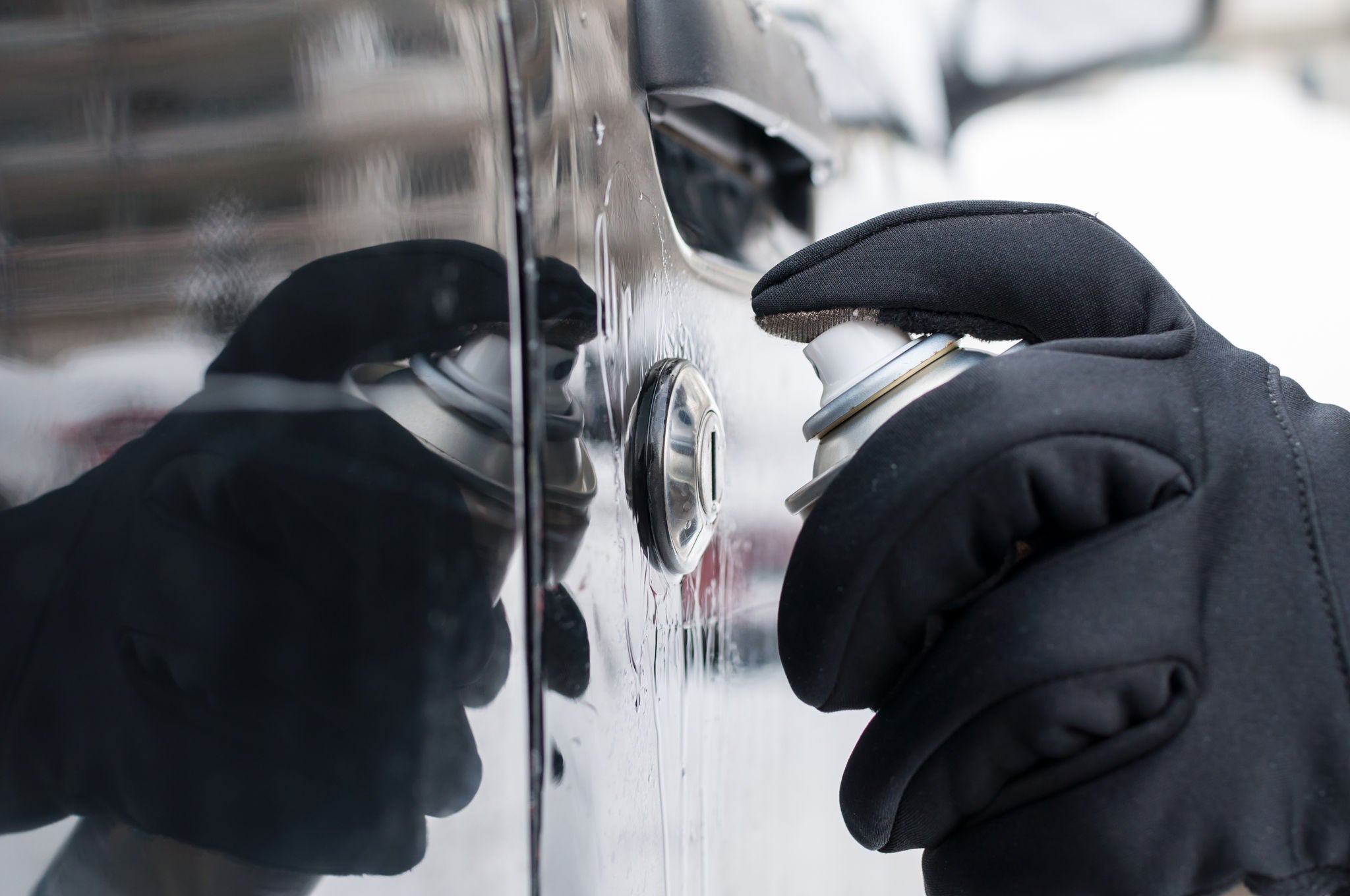 Uniroyal - Closeup of man hand with lock door de-icer